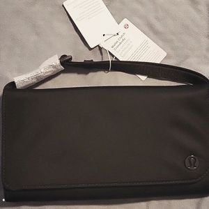 Lululemon cross body, NWT. I removed tags but never wore the bag.